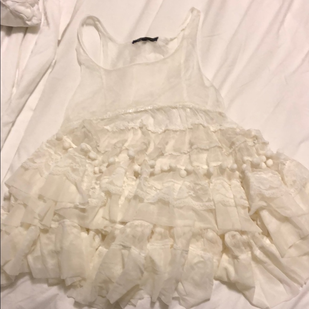 Sheer BCBG top with poms